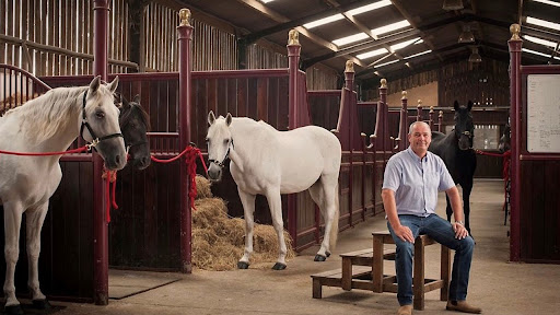 Steve with horse in stable